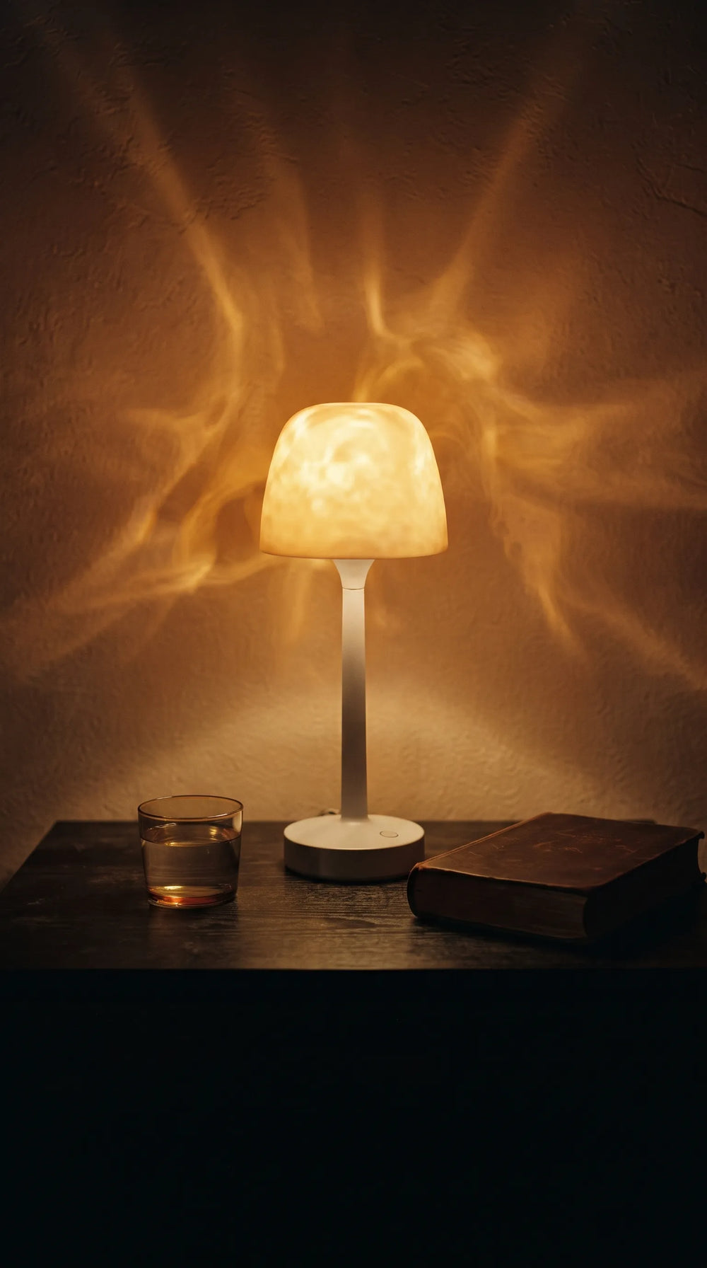 The lamp glowing in a dark bathroom