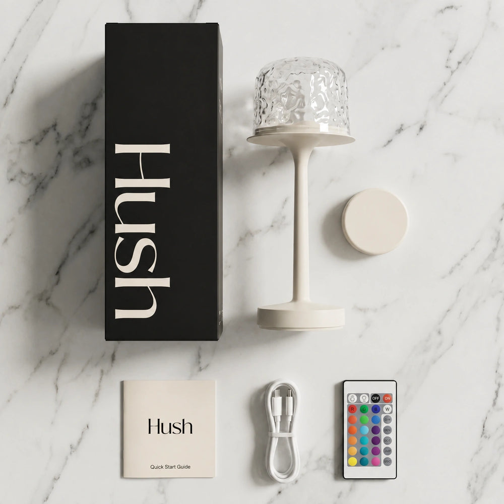 Hush Ember® lamp, dome, remote and USB-C cable laid out